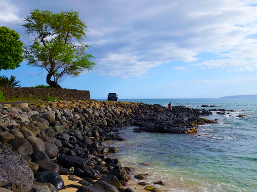 Jeep Wrangler rental driving near beach on Maui, Hawaii